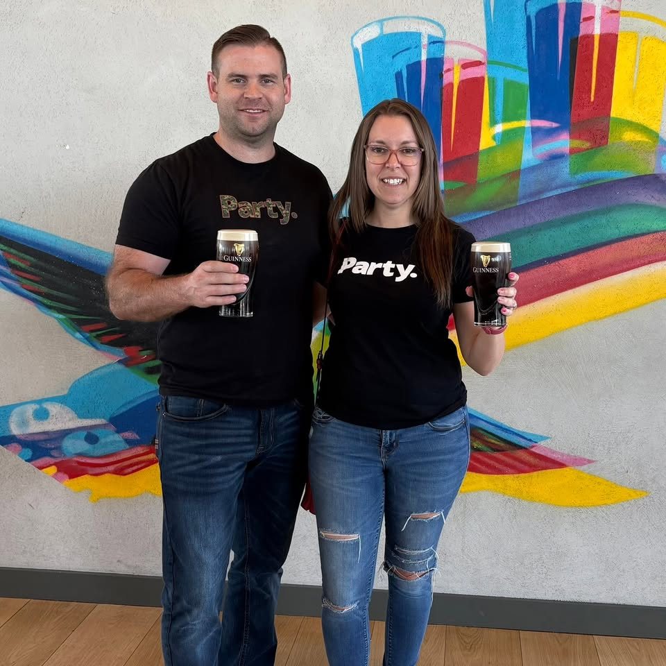 Friends in Party. shirts with pints at a colorful mural