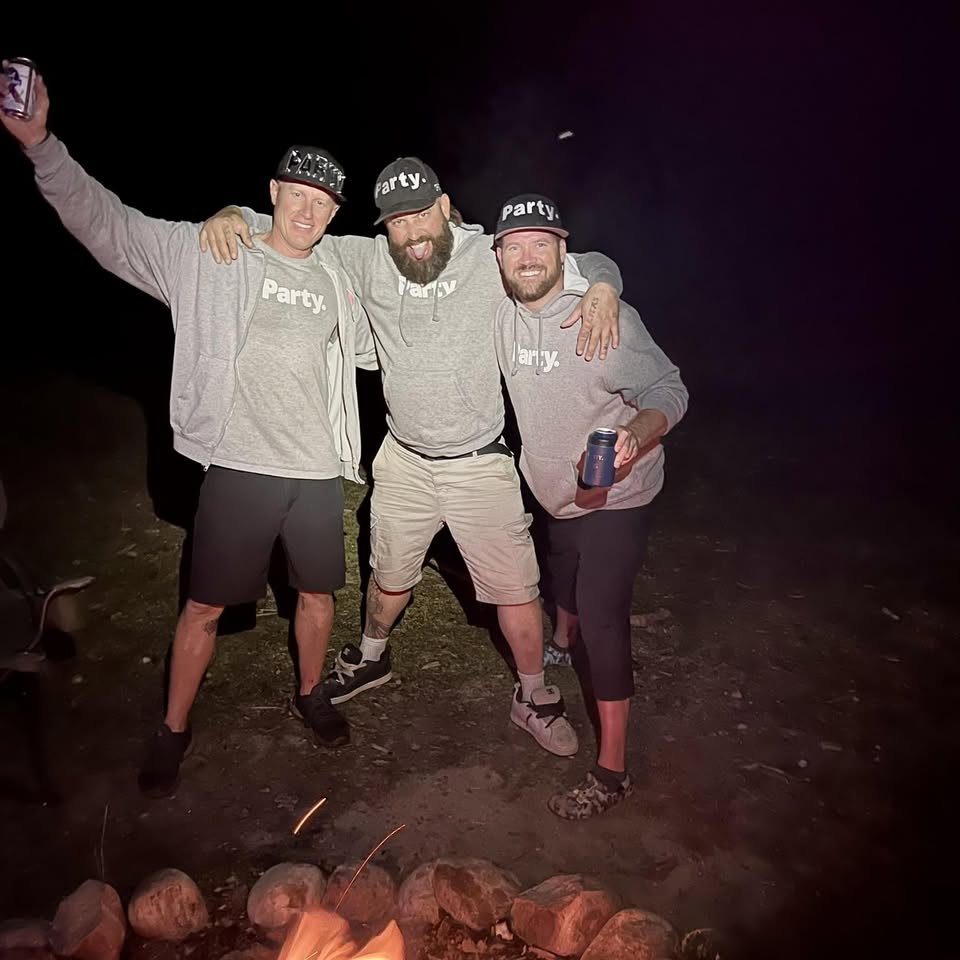 Friends in Party. gear around a campfire