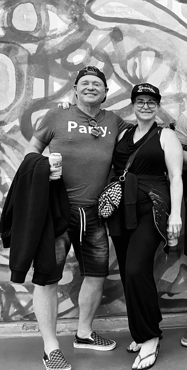 Friends in Party. gear by a mural