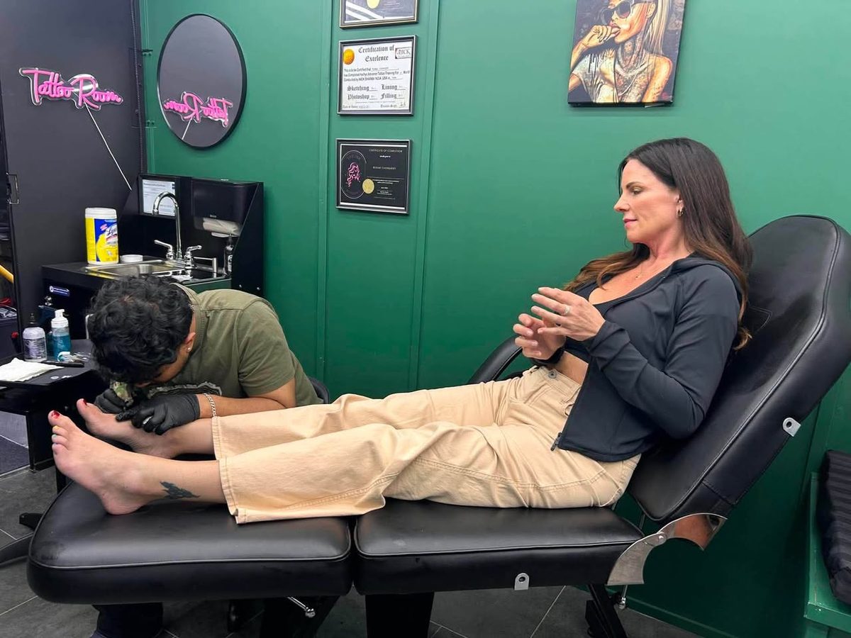 A friend getting inked in the tattoo room