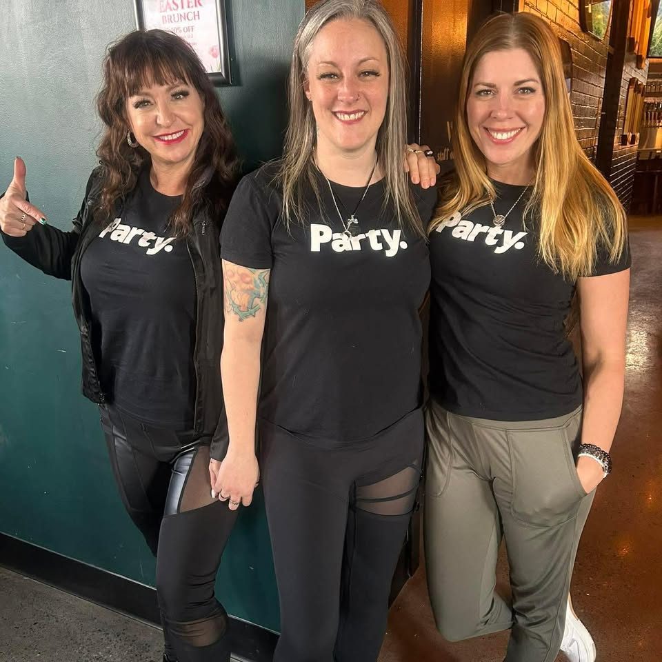 Friends smiling in matching Party. shirts